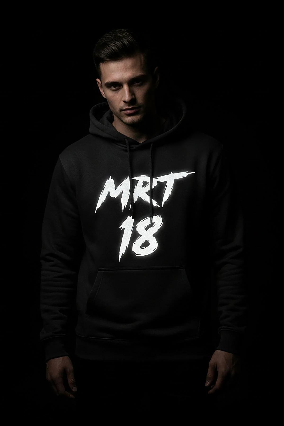 Black custom reflective graphic hoodie on a man, white brushed text "MERT 18"