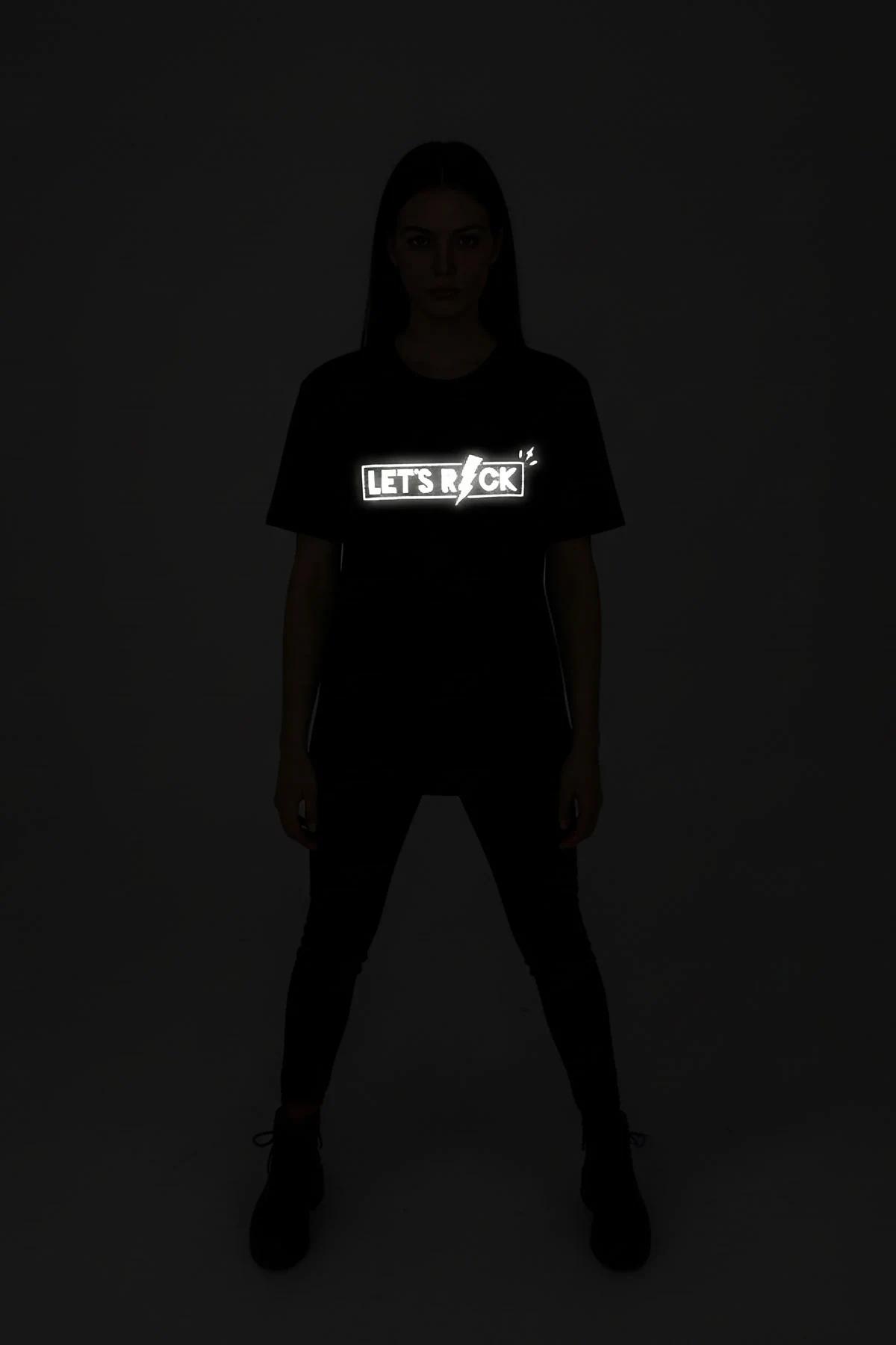 Reflective black festival tee with bright '