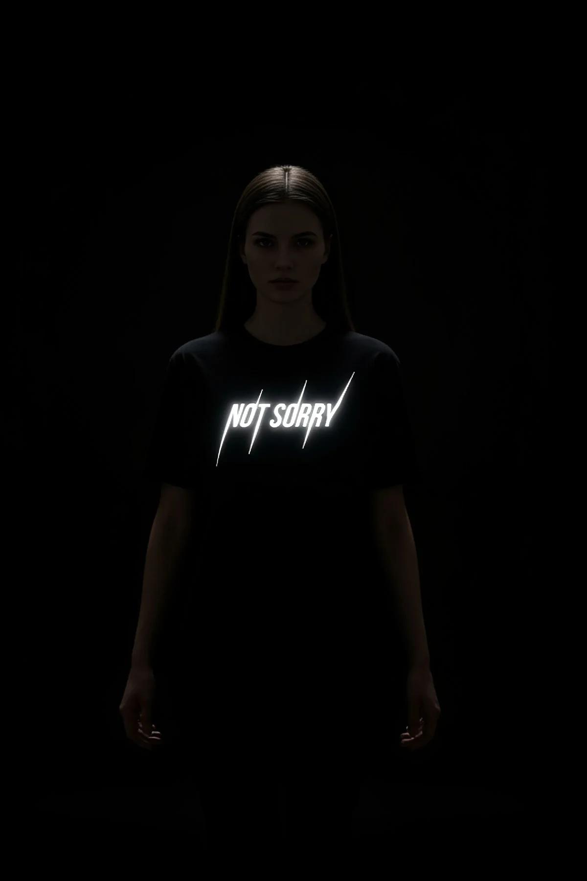 Reflective black streetwear top with bold "