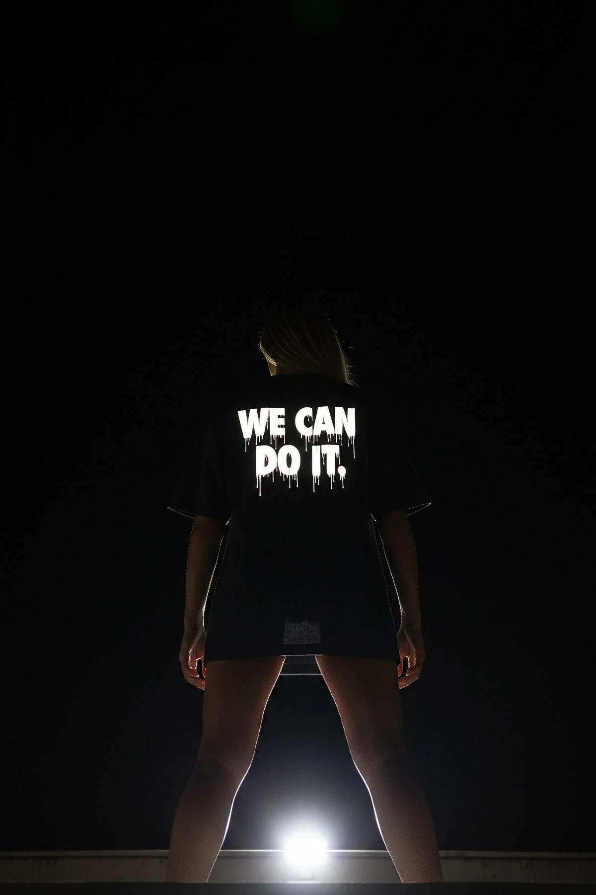 Black reflective t-shirt dripping text graphic and visible back graphic