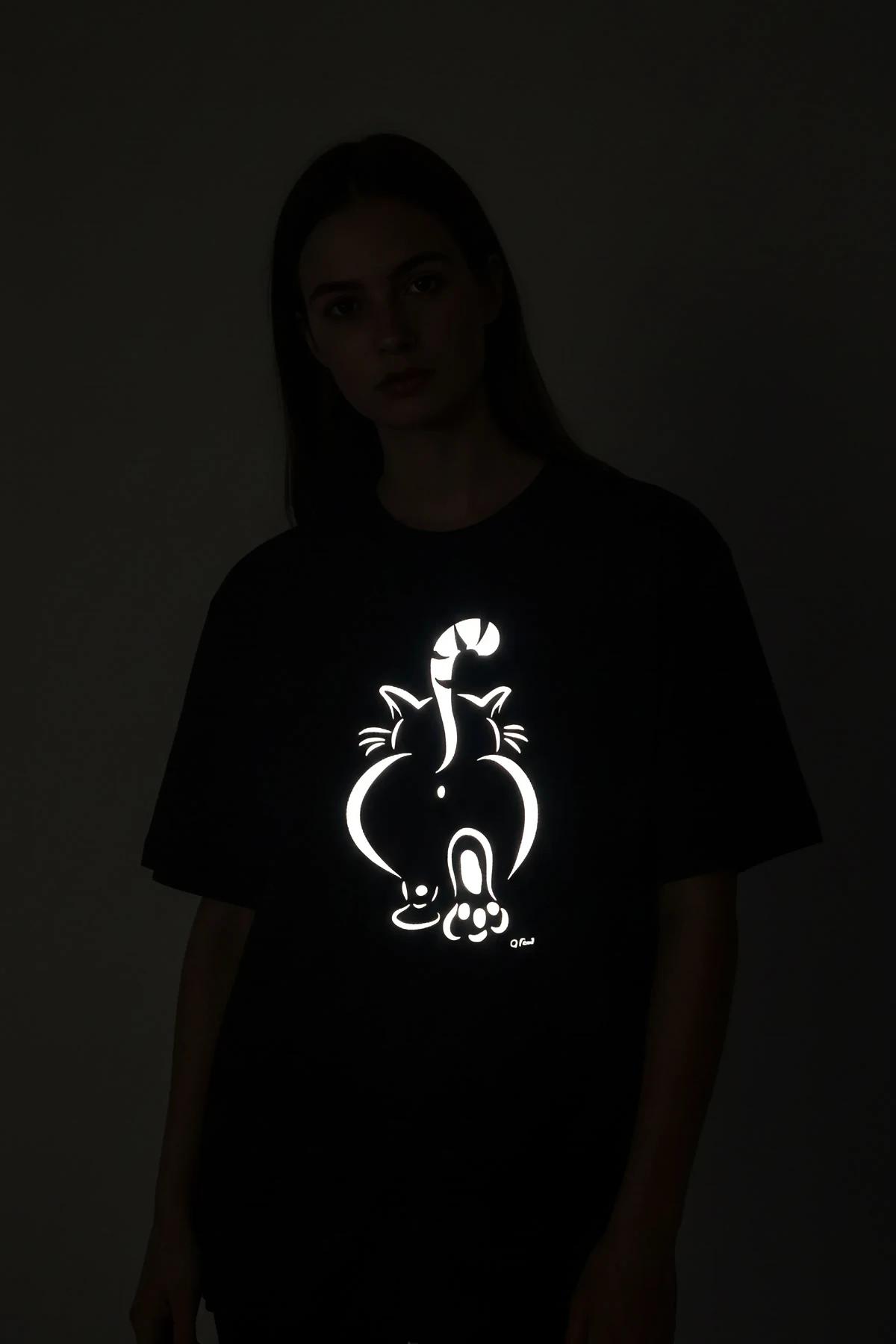 Black Custom Reflective T-Shirt with 'FATMA' graphic for men, model wearing dark sunglasses