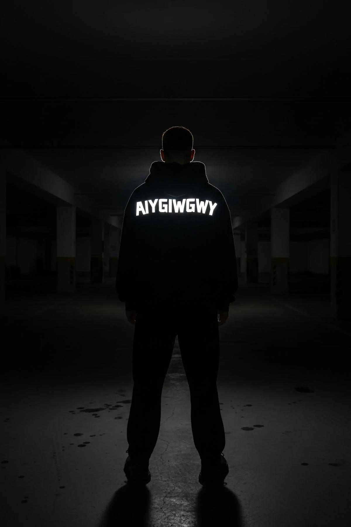 Men's Reflective Hoodie Side Profile Sleeve Design in black with glow-in-the-dark custom text on back visible in dark