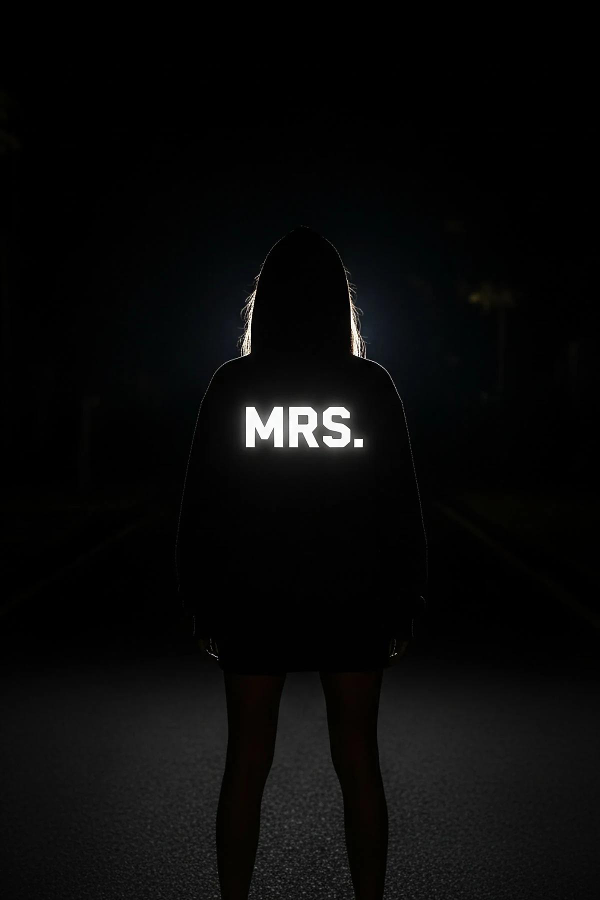 Black Mrs. Hoodie Flat Lay with Glowing Sleeve Close-Up