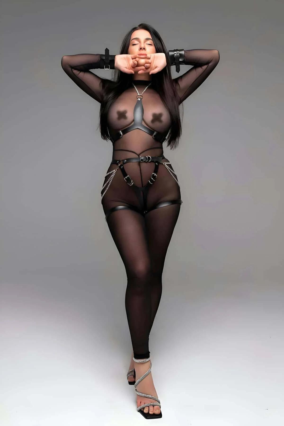Provocative Black Faux Leather Open Crotch Lingerie Set with Chest Harness and Metallic Cuffs