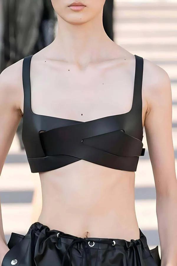 black matte faux leather criss-cross chest harness top with wide X-strap detail and structured bralette panel