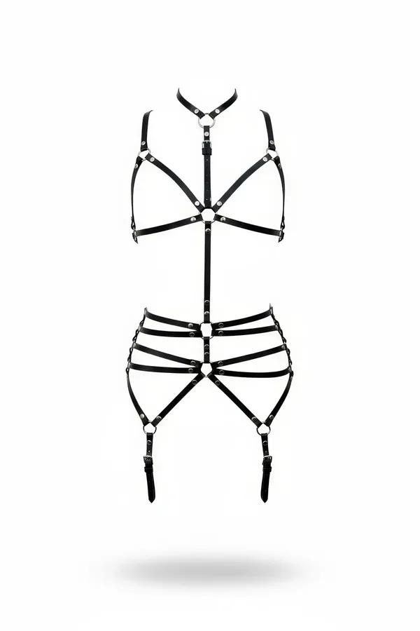 Black faux leather full body harness with silver O-rings, cage bra top, triple hip bands, and garter straps on white backgrou