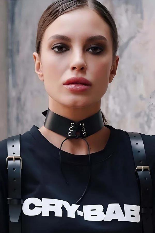 black faux leather wide choker with silver eyelets and lace-up front cord worn on neck