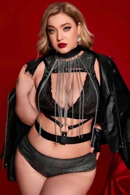 Black faux leather choker neck body harness with cascading silver chain fringe across chest and adjustable underbust buckle